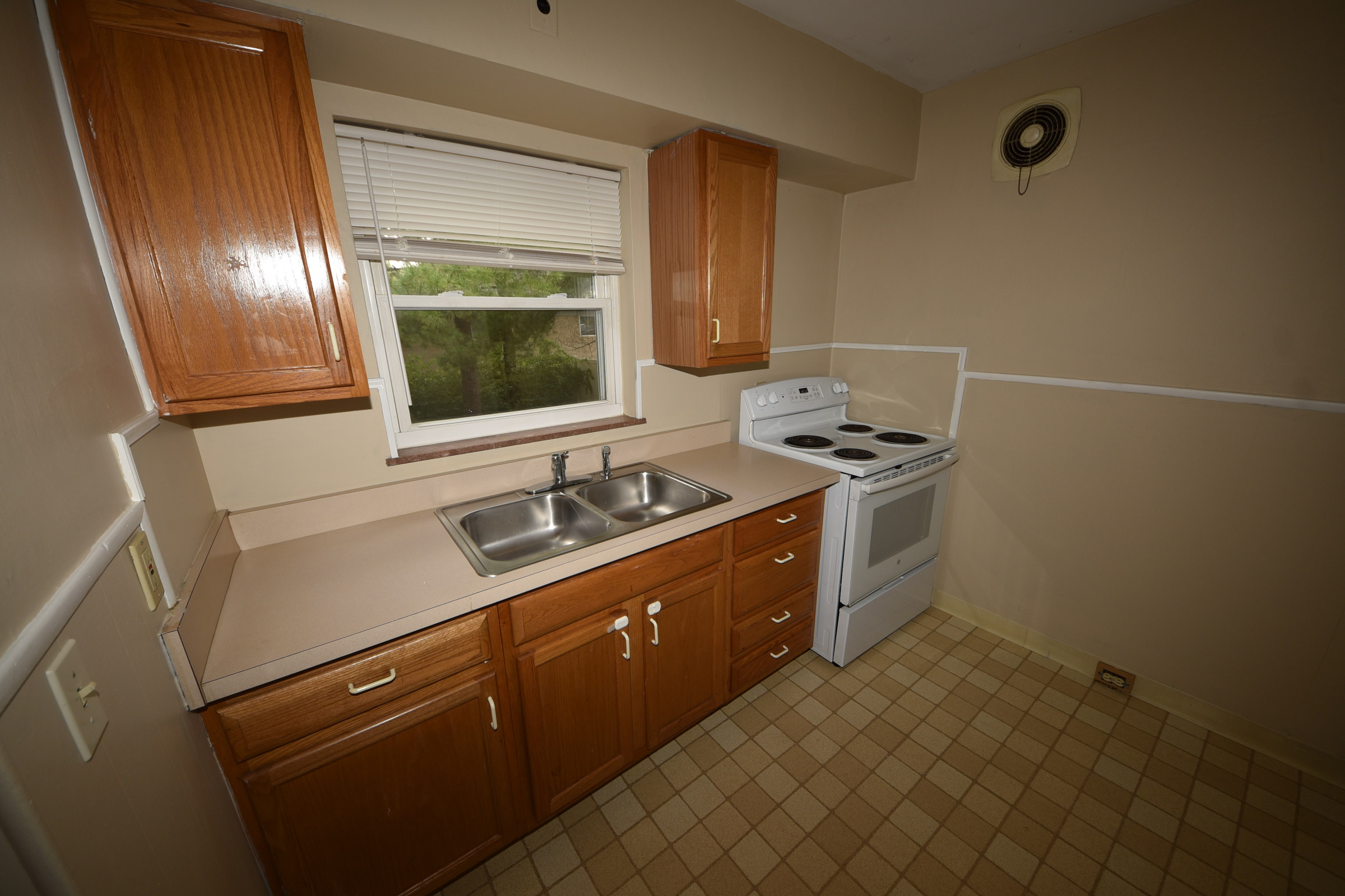 Kitchen — cabinets and range at 7222 Chetbert Drive